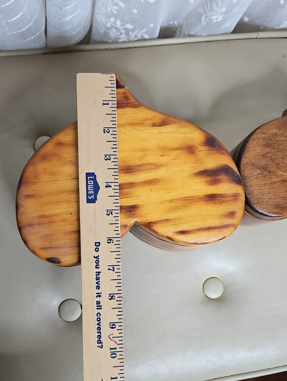 Two handmade, heart-shaped wooden boxes with visible grain patterns